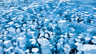 This Surreal Lake Full of Frozen Bubbles Is Actually On Planet Earth